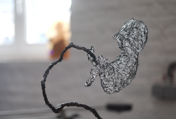 Death Stranding Baby sculpted with a 3d pen and clear plastic strands.